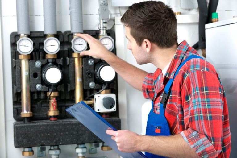 30402625 - technician servicing the gas boiler for hot water and heating